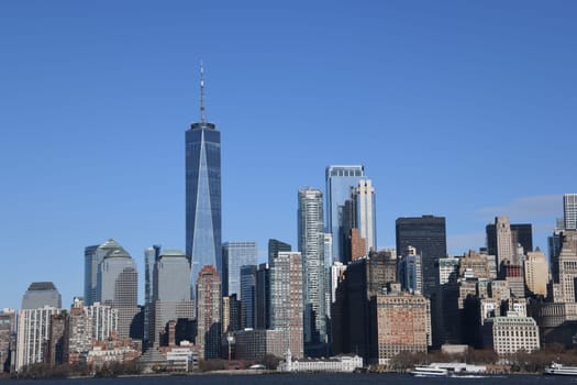 The impressive southern tip,financial district and skyline of Manhattan can be seen from the ferry to Staten Island.