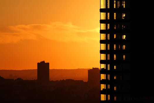 The orange sunset and the high rise buildings