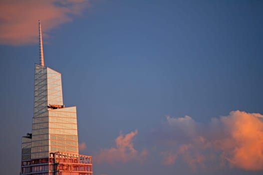 The pink clouds and the mirrored skyscraper