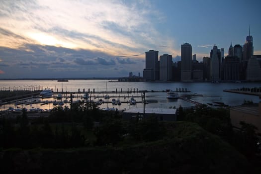 The sunset over Downtown Manhattan and the pier