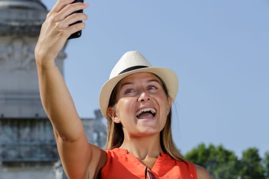 young female tourist taking selfie