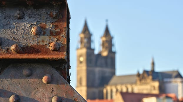 Detail of the ailing lift bridge on the Elbe in Magdeburg. In the background the Magdeburg Cathedral.