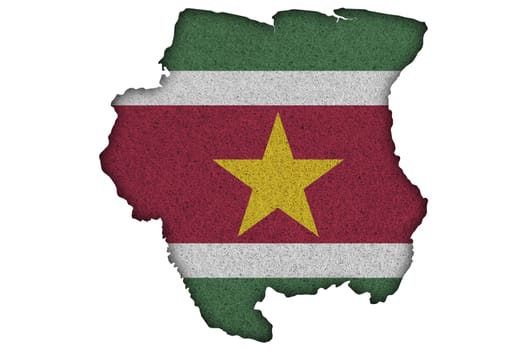 Map and flag of Suriname on felt