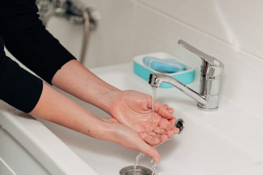 The Girl Washes Her Hands to Avoid Infection With the Virus COVID-19.