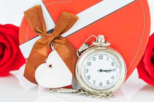 Close up pocket watch and red roses flower with copy space, Valentine'sDay concept