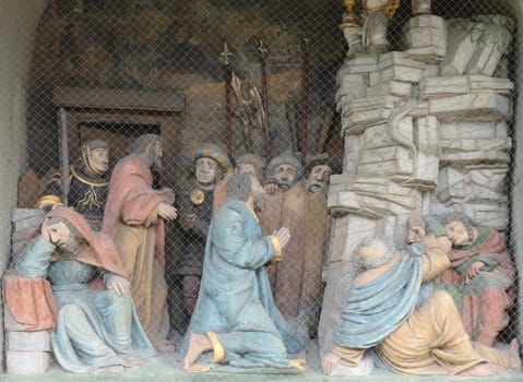 Jesus on the Mount of Olives, surrounded by approaching soldiers and the Apostles, portal of the church of St. Leodegar in Lucerne, Switzerland
