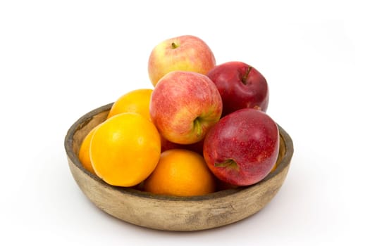fresh fruits in a clay bowl - oranges and apples