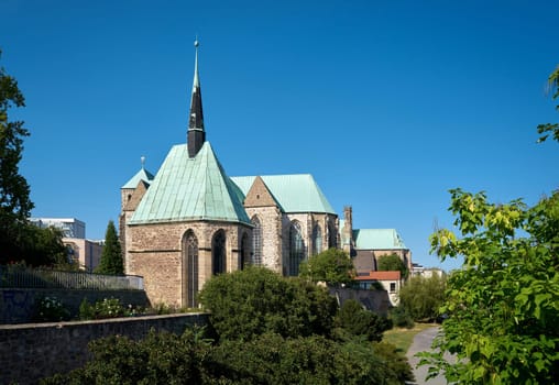 Magdalene Chapel on the banks of the River Elbe near Magdeburg. Behind it the Petri Church and the Walloon Church