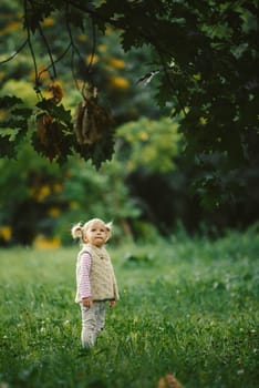 the blonde haired girl on the forest with tear in eye