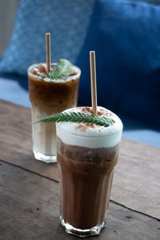 Coffee glass decorated with fern leaf, stock photo