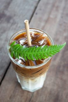 Coffee glass decorated with fern leaf, stock photo