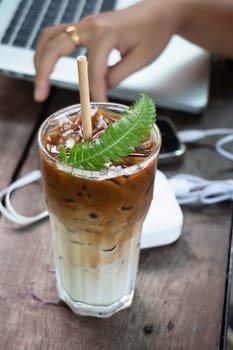 Coffee glass decorated with fern leaf, stock photo