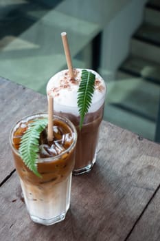 Coffee glass decorated with fern leaf, stock photo