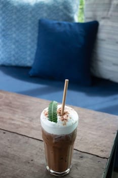 Coffee glass decorated with fern leaf, stock photo