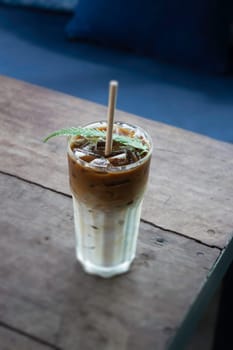Coffee glass decorated with fern leaf, stock photo