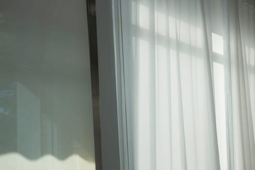 Soft curtain in modern white room, stock photo