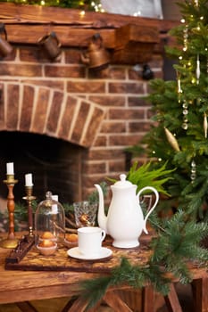 Home Christmas decoration interior late in night with light on xmas tree and fireplace.
