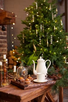 Home Christmas decoration interior late in night with light on xmas tree and fireplace.