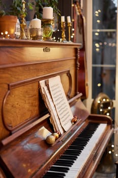 Home Christmas decoration interior late in night with light on piano.