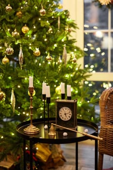 Home Christmas decoration interior late in night with light on xmas tree and gifts.