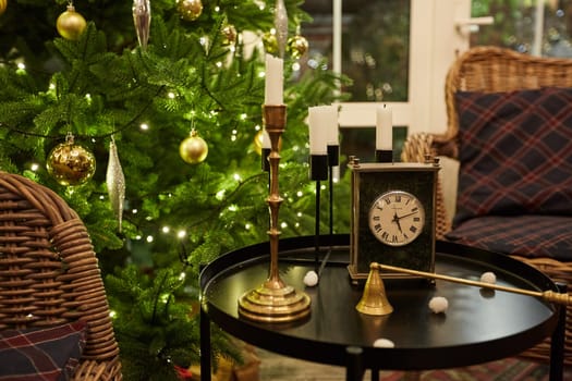 Home Christmas decoration interior late in night with light on xmas tree and gifts.