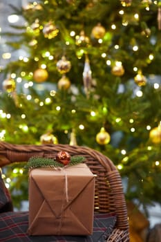 Home Christmas decoration interior late in night with light on xmas tree and gifts.