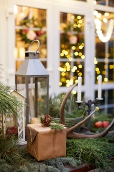 Home Christmas decoration interior late in night with light on xmas tree and gifts.