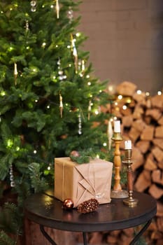 Home Christmas decoration interior late in night with light on xmas tree and gifts.