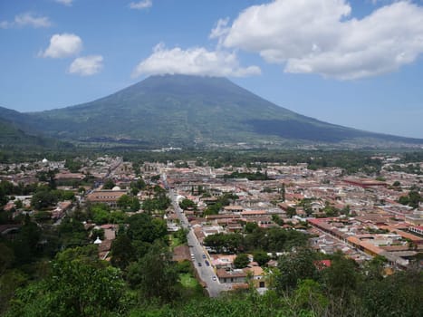 The city of La Antigua is located at the foot of the Agua volcano in the Panchoy Valley. The place is located in the central highlands of Guatemala of the three volcanoes Agua,Acatenango and Fuego.