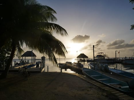 Sunset at the harbor and beach in the village of Caye Caulker in Belize