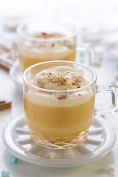Eggnog with cinnamon and nutmeg with small tree cookies for Christmas and winter holidays.