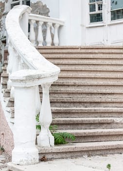 The old stone stairs at an abandoned old building. Selective focus