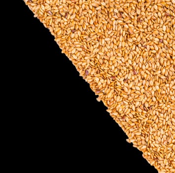 Background texture of roasted golden flax seed or linseed with healthy omega-3 fatty acids, dietary fiber, rich in oils and used to lower cholesterol