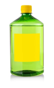 The plastic transparent bottle with green chemical liquid with label on white