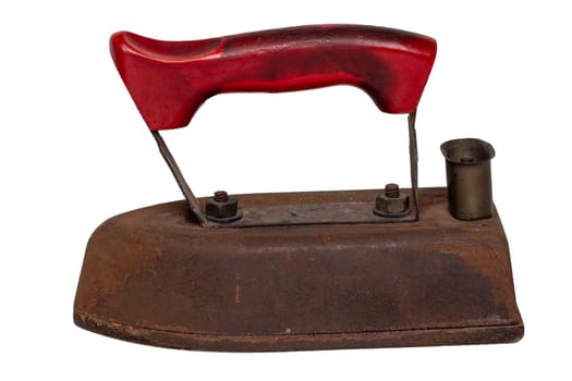 Old iron isolated. Close-up of a professional old rusty electric tailor iron with a red handle isolated on a white background. Tailoring accessories.