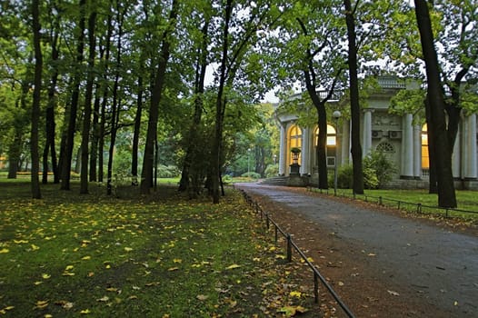 A palace in an early autumn park at evening in Saint Petersburg, Russia.