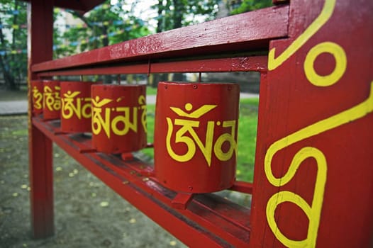 Prayer wheels near ancient buddhist temple in St Petersburg, Russia