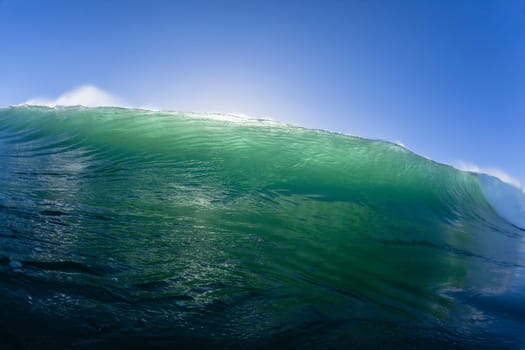 Ocean wave water crashing swell swimming surfing  morning backlight