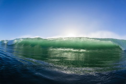Ocean wave water crashing swell swimming surfing  morning backlight