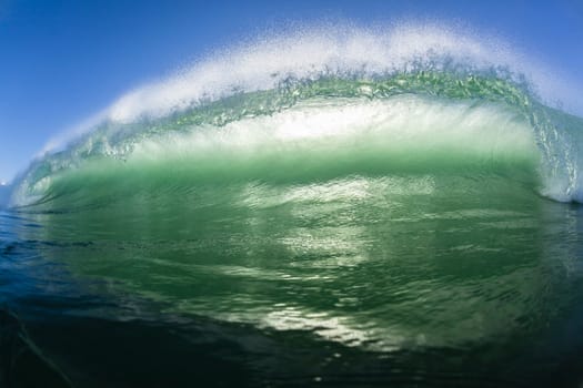 Ocean wave water crashing swell swimming surfing  morning backlight