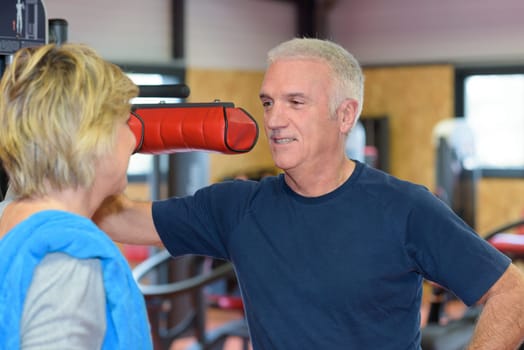 portrait of a mature couple in a gym