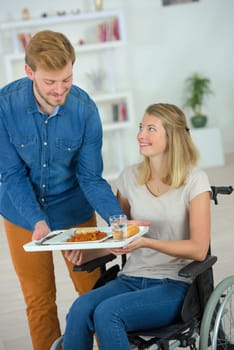 Helpful boyfriend bringing her lunch