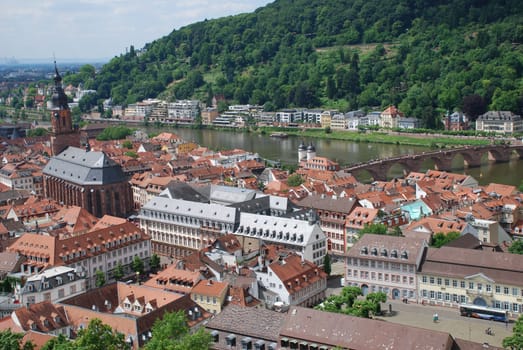 A view of the old town of Heidelberg in Baden Württemberg with the Church of the Holy Spirit,the Old Bridge and the river Neckar.