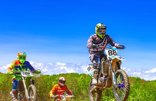 Kamchatka, Russia- 29 June 2019: Motocross riders practice tricks on their dirt bikes on a sunny day in Kamchatka