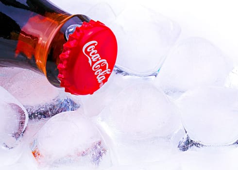 Chisinau, Moldova April - 03, 2017:l Classic Coca-Cola bottle with ice. Coca-Cola Company is the most popular market leader in Europe