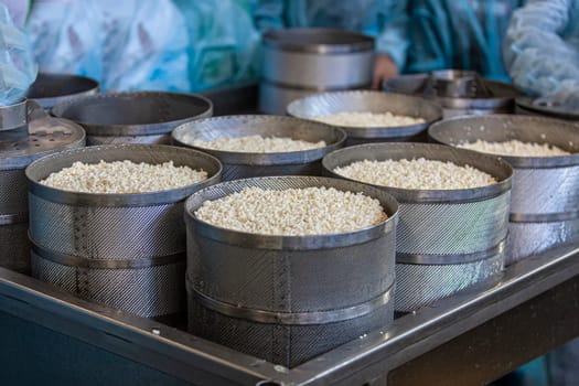 The Making delicious cheese at a cheese factory. Selective focus