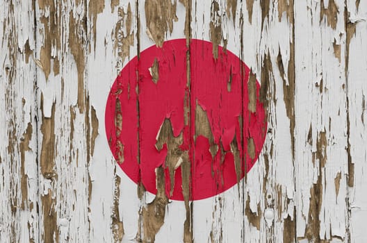 Flag of Japan on a weathered wooden wall