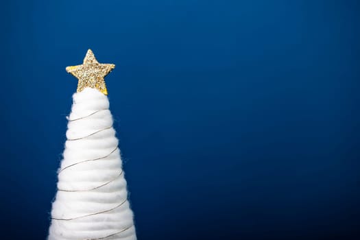 Magic holiday background with white christmas tree and shiny christmas lights