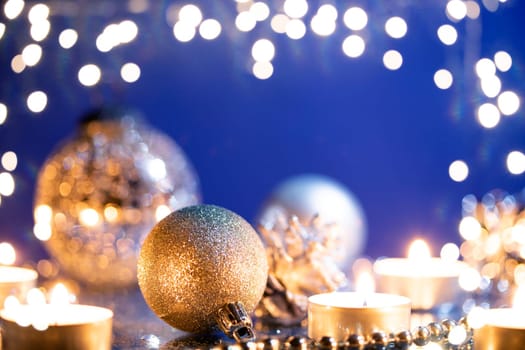 Silver Christmas balls over sparkling holiday background. Magic holiday lights. Merry Christmas and a Happy New Year