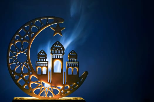 Ornamental Arabic decoraion with burning candle glowing at night and glittering golden bokeh lights. Festive greeting card for Muslim holy month Ramadan Kareem.